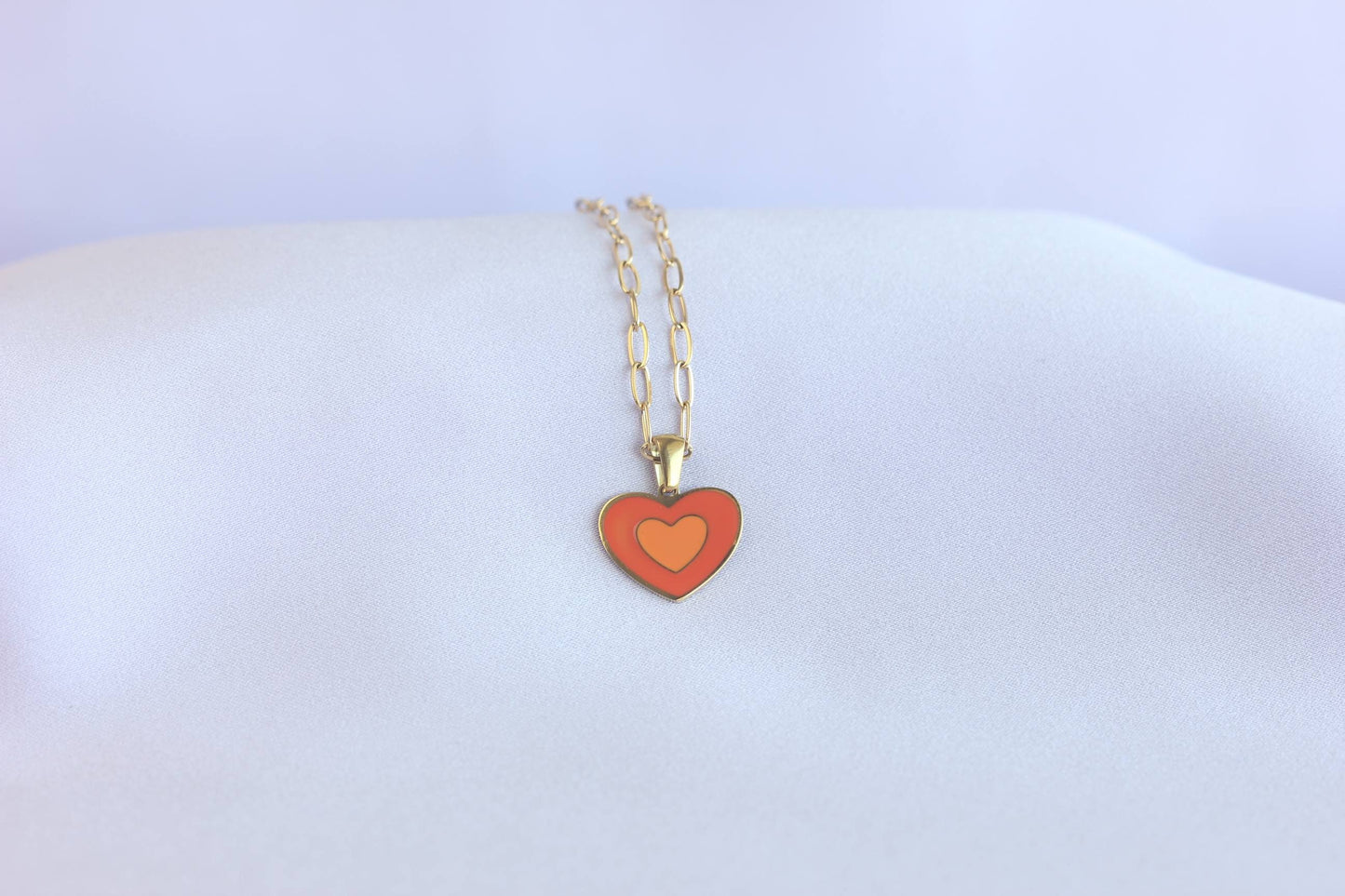 Brighten up your outfit with our Colorful Heart Pendant Chain Necklaces! Whether you're dressing up for a special event or adding a pop of color to your everyday look, this necklace offers dainty and colorful style. Perfect gift for her.