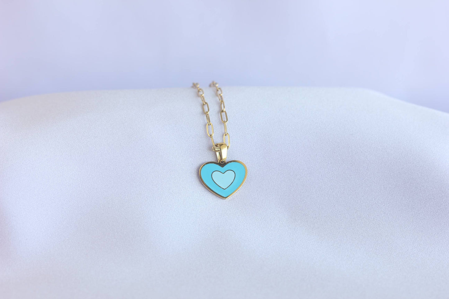 Brighten up your outfit with our Colorful Heart Pendant Chain Necklaces! Whether you're dressing up for a special event or adding a pop of color to your everyday look, this necklace offers dainty and colorful style. Perfect gift for her.