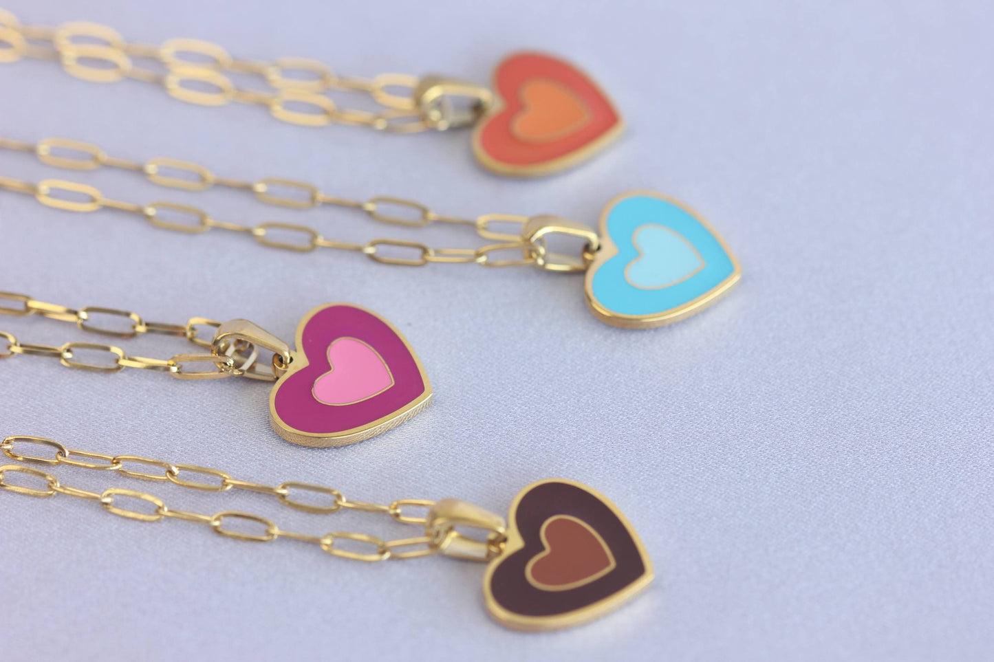 Brighten up your outfit with our Colorful Heart Pendant Chain Necklaces! Whether you're dressing up for a special event or adding a pop of color to your everyday look, this necklace offers dainty and colorful style. Perfect gift for her.