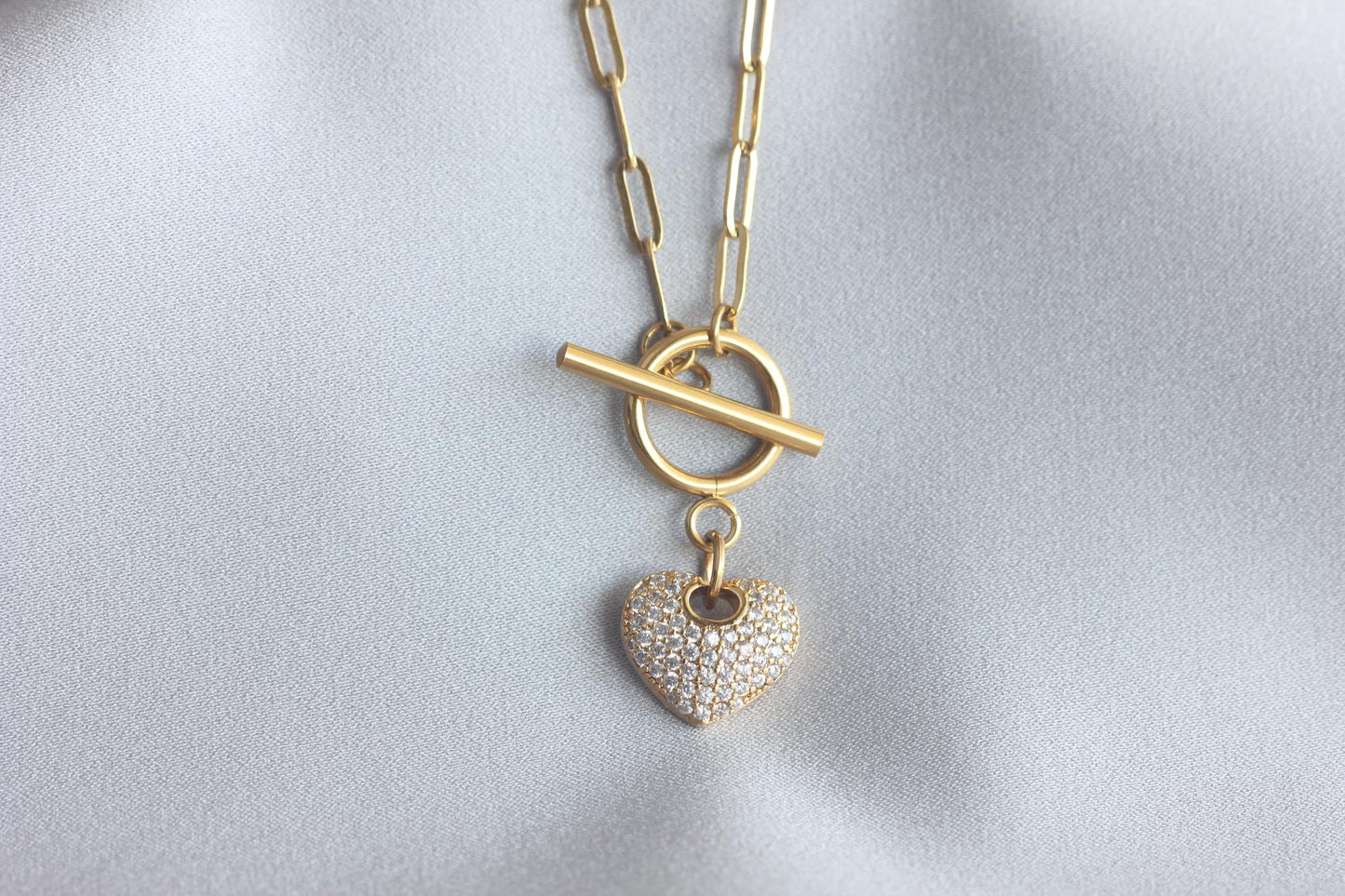 Link Chain Drop Heart Necklace reflects the beautiful harmony between one of the most popular chain type Link Chain and Cubic zirconia beaded shiny heart charm. Perfect gift for your her or for yourself!