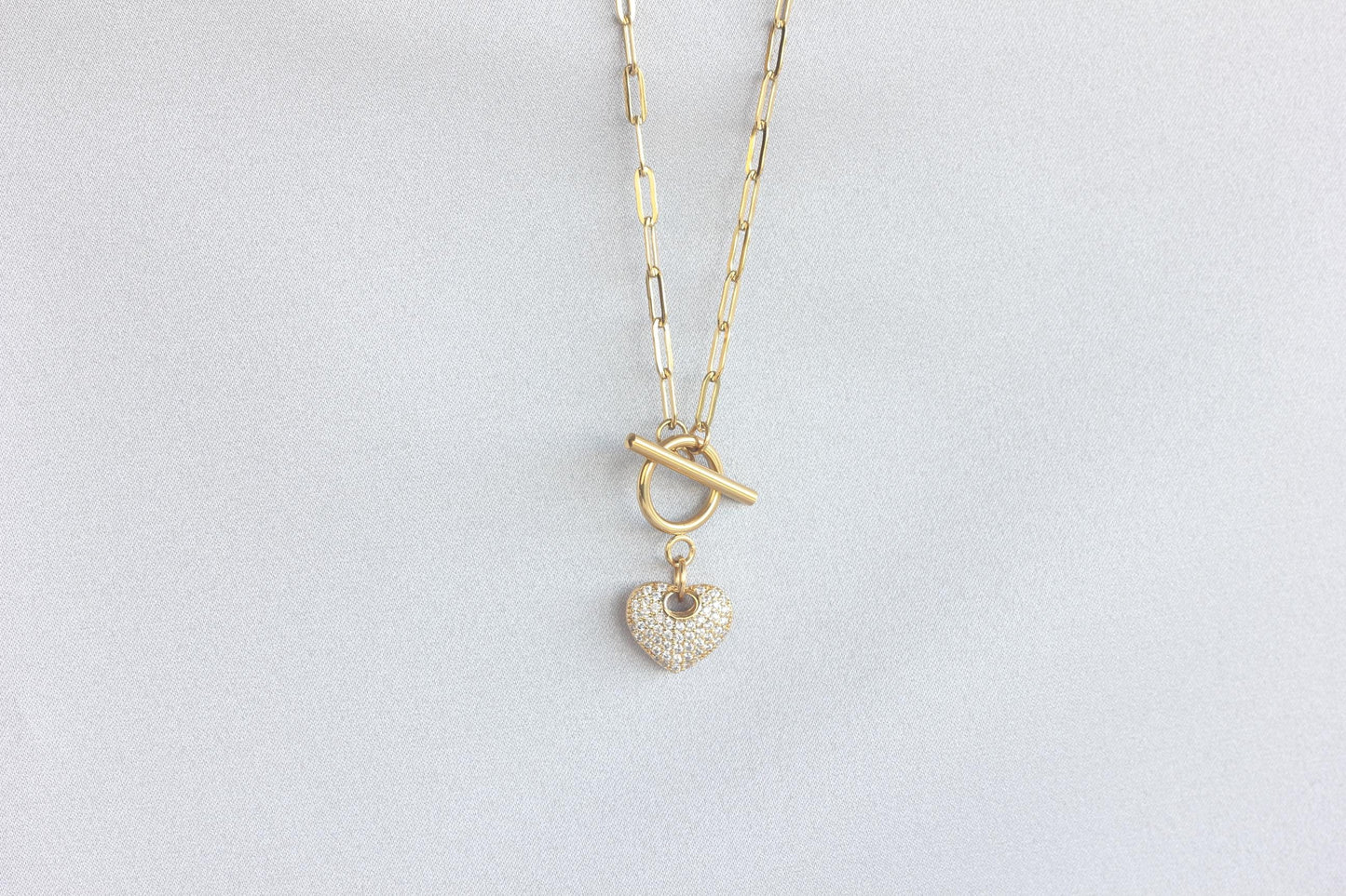 Link Chain Drop Heart Necklace reflects the beautiful harmony between one of the most popular chain type Link Chain and Cubic zirconia beaded shiny heart charm. Perfect gift for your her or for yourself!