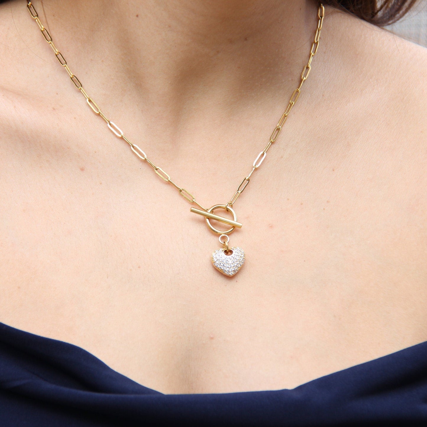 Link Chain Drop Heart Necklace reflects the beautiful harmony between one of the most popular chain type Link Chain and Cubic zirconia beaded shiny heart charm. Perfect gift for your her or for yourself!