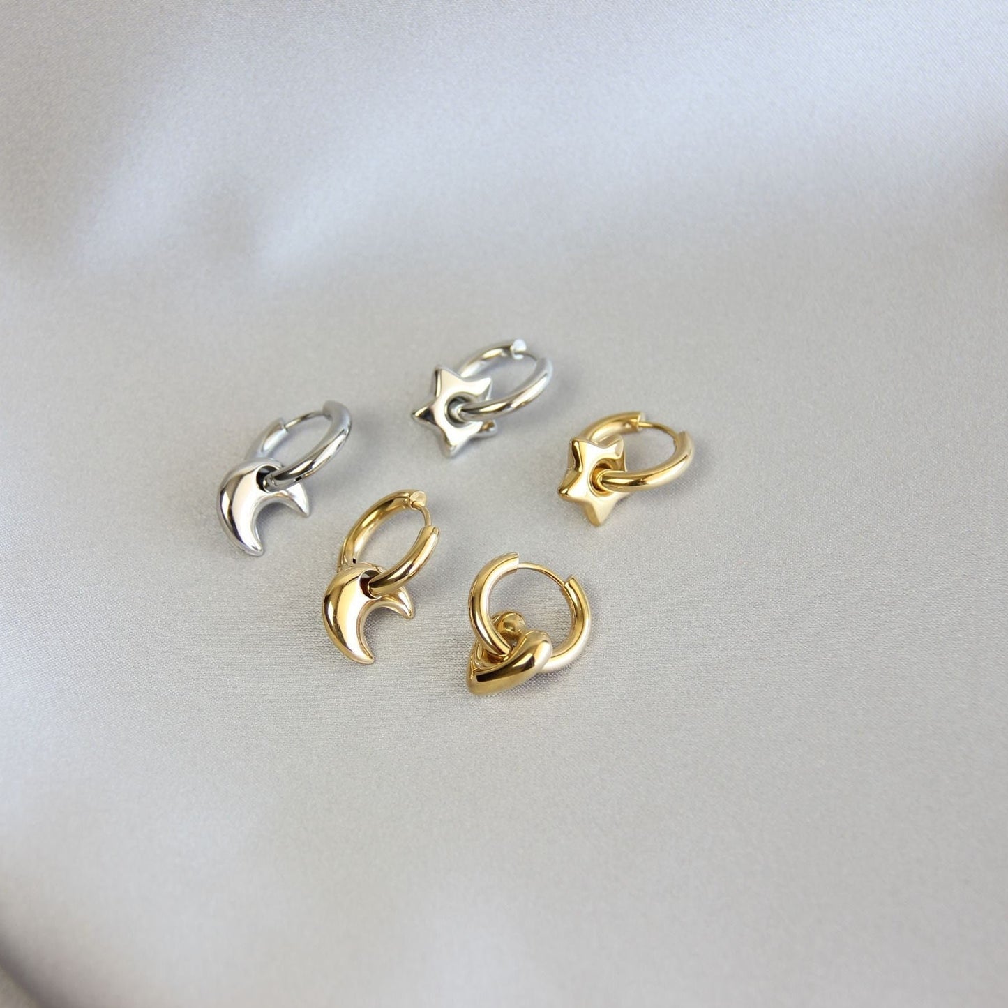 Star, Moon and Heart Pendant Gold Huggie Earrings. Mix and Match 18K gold hoop celestial earrings. Perfect gift for your loved ones.