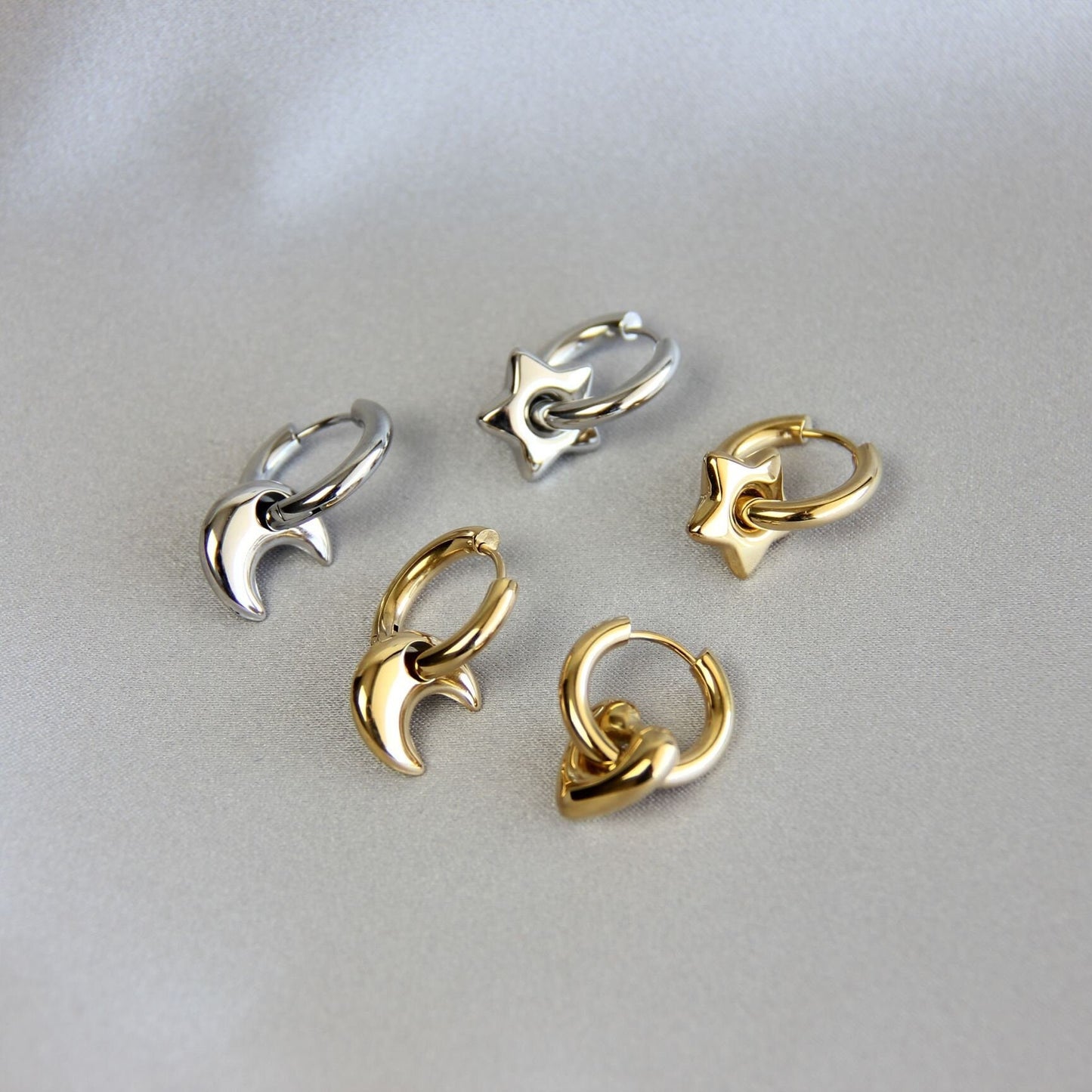 Star, Moon and Heart Pendant Gold Huggie Earrings. Mix and Match 18K gold hoop celestial earrings. Perfect gift for your loved ones.