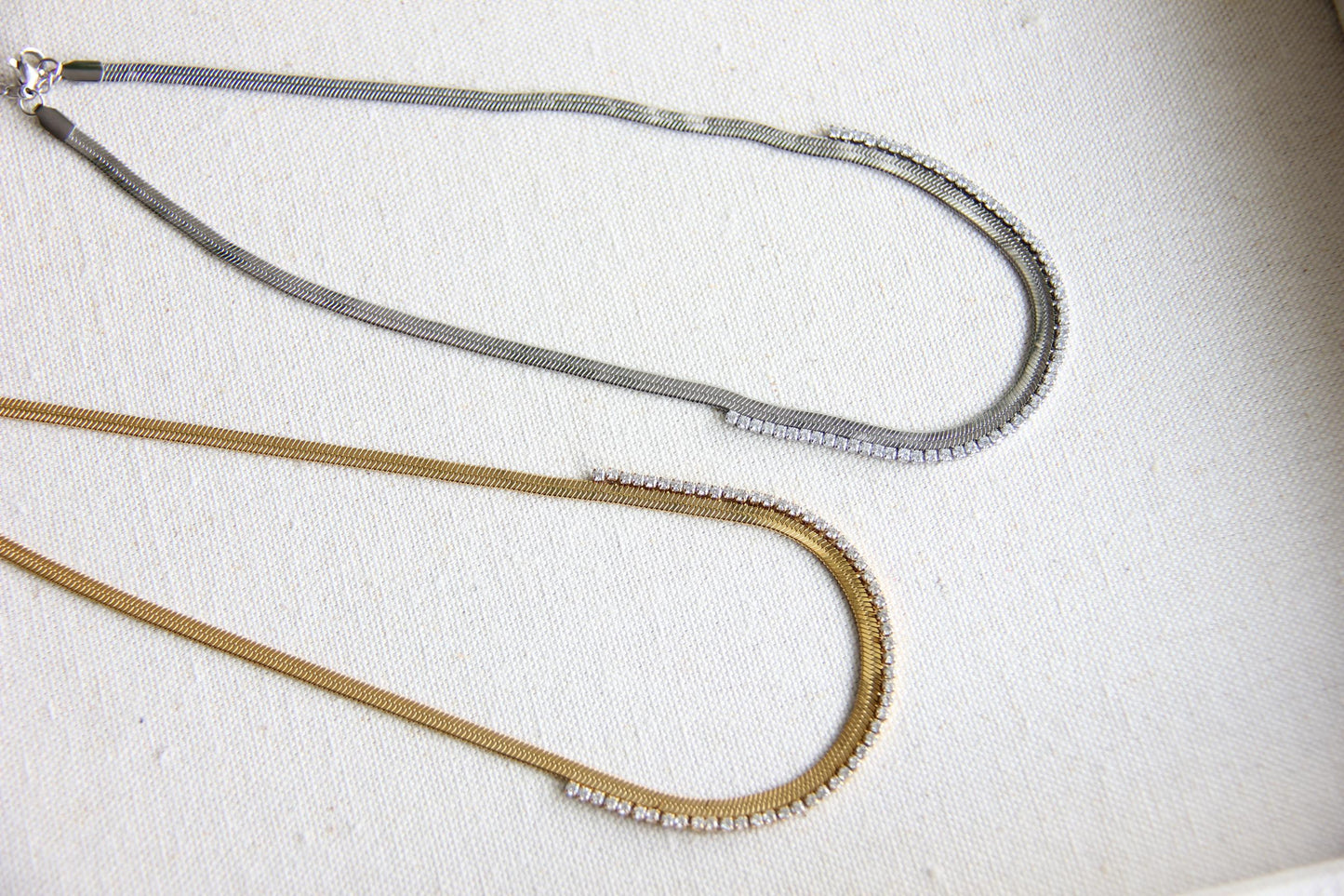 Gold snake necklace with sparkling zirconia stones, featuring a unique and minimalist design. Dainty and trendy serpent chain statement necklace, perfect for layering or wearing solo.