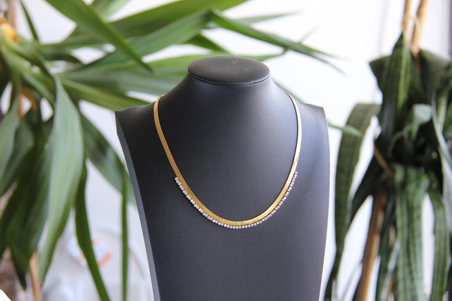 Gold snake necklace with sparkling zirconia stones, featuring a unique and minimalist design. Dainty and trendy serpent chain statement necklace, perfect for layering or wearing solo.