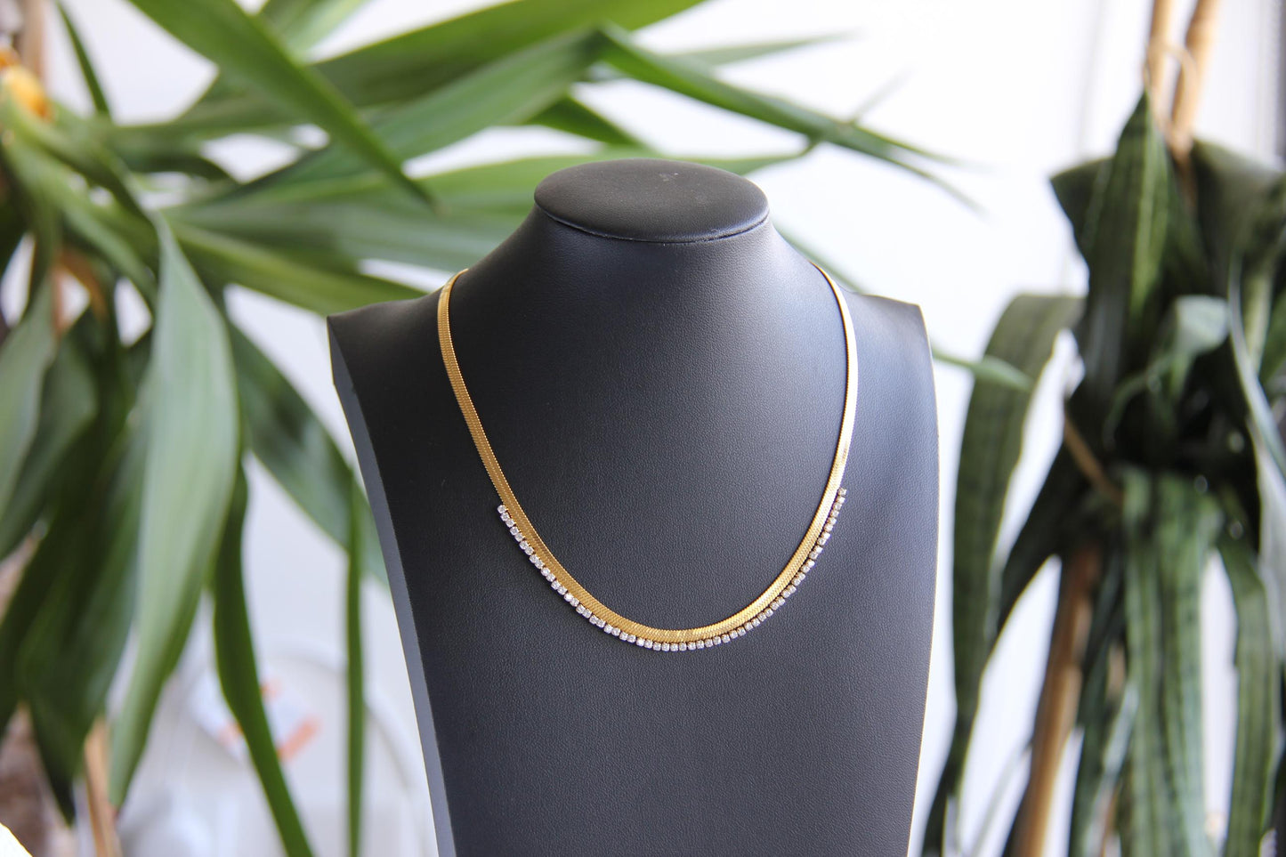 Gold snake necklace with sparkling zirconia stones, featuring a unique and minimalist design. Dainty and trendy serpent chain statement necklace, perfect for layering or wearing solo.