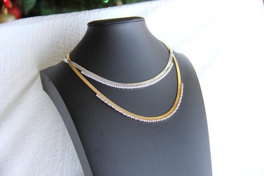 Gold snake necklace with sparkling zirconia stones, featuring a unique and minimalist design. Dainty and trendy serpent chain statement necklace, perfect for layering or wearing solo.