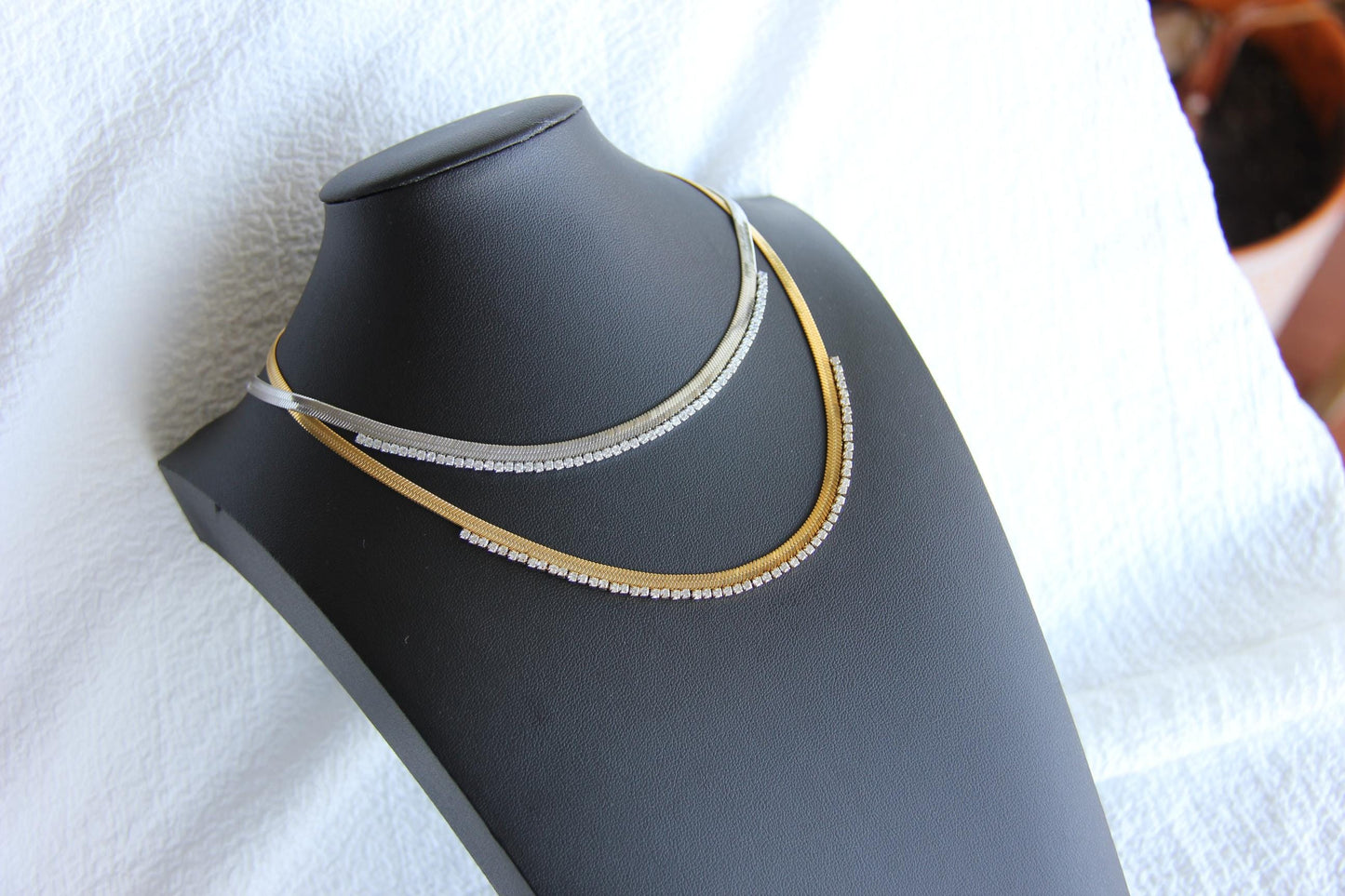 Gold snake necklace with sparkling zirconia stones, featuring a unique and minimalist design. Dainty and trendy serpent chain statement necklace, perfect for layering or wearing solo.