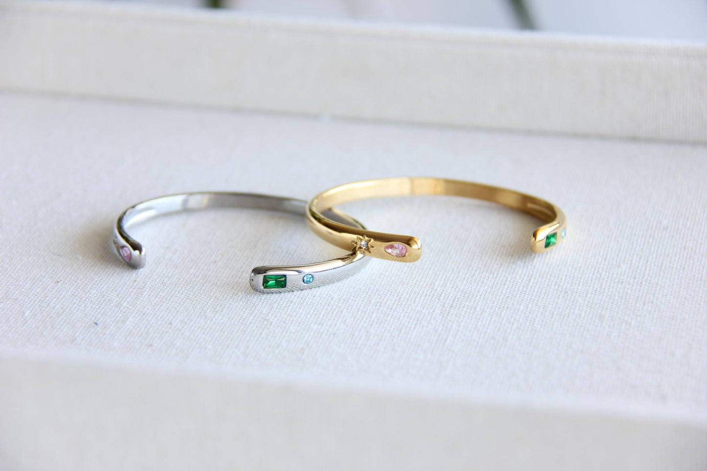 Gold and silver open cuff bracelet with pink gemstone and starburst engraving. Elegant celestial-inspired jewelry, perfect for stacking or wearing alone. Minimalist astrology bracelet, great gift for women who love dainty and cosmic jewelry.
