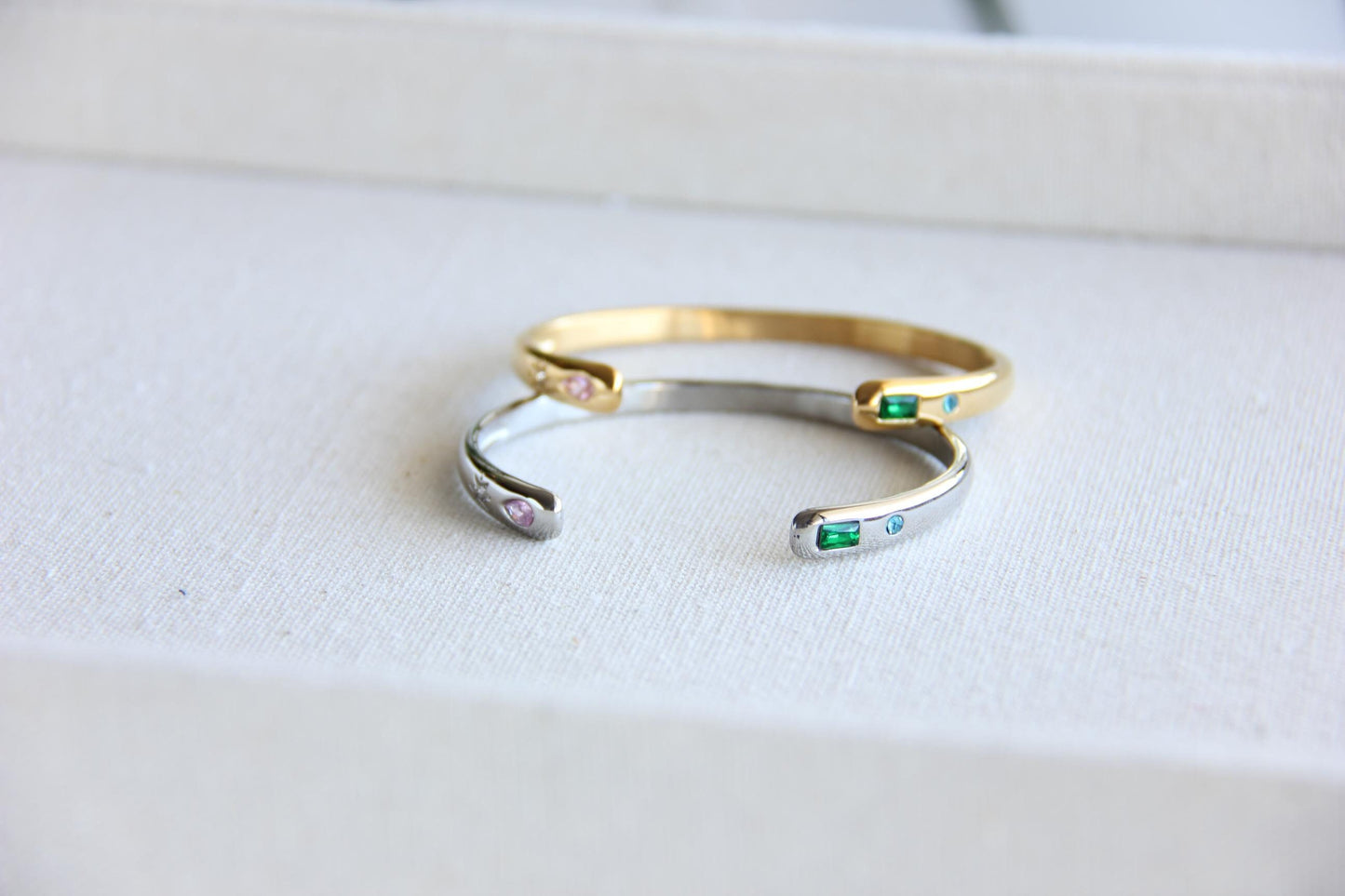 Gold and silver open cuff bracelet with pink gemstone and starburst engraving. Elegant celestial-inspired jewelry, perfect for stacking or wearing alone. Minimalist astrology bracelet, great gift for women who love dainty and cosmic jewelry.