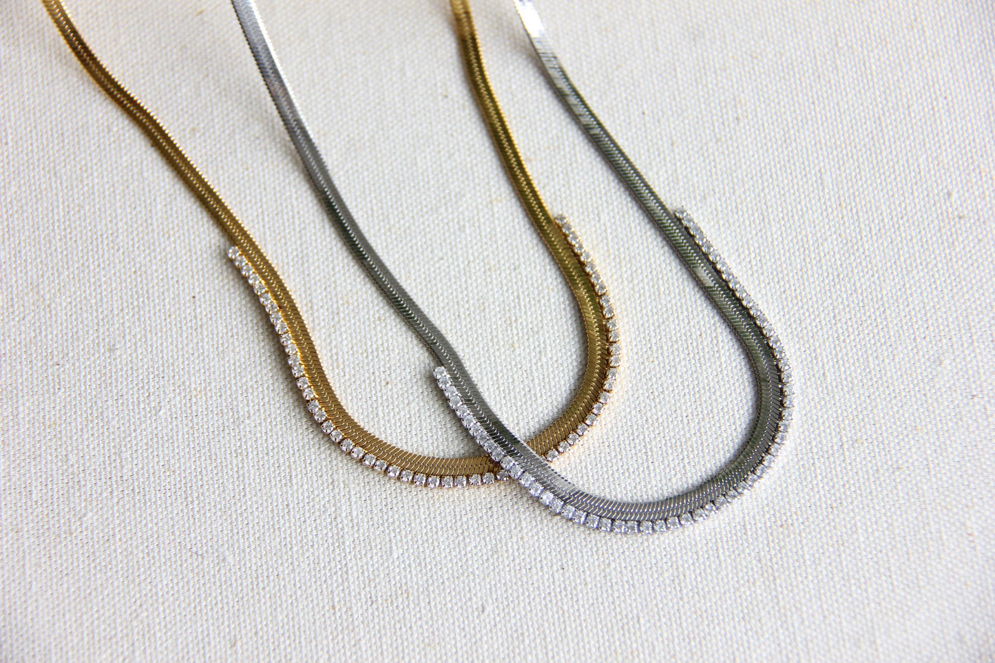 Gold snake necklace with sparkling zirconia stones, featuring a unique and minimalist design. Dainty and trendy serpent chain statement necklace, perfect for layering or wearing solo.