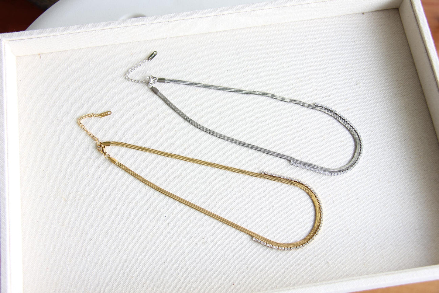 Gold snake necklace with sparkling zirconia stones, featuring a unique and minimalist design. Dainty and trendy serpent chain statement necklace, perfect for layering or wearing solo.