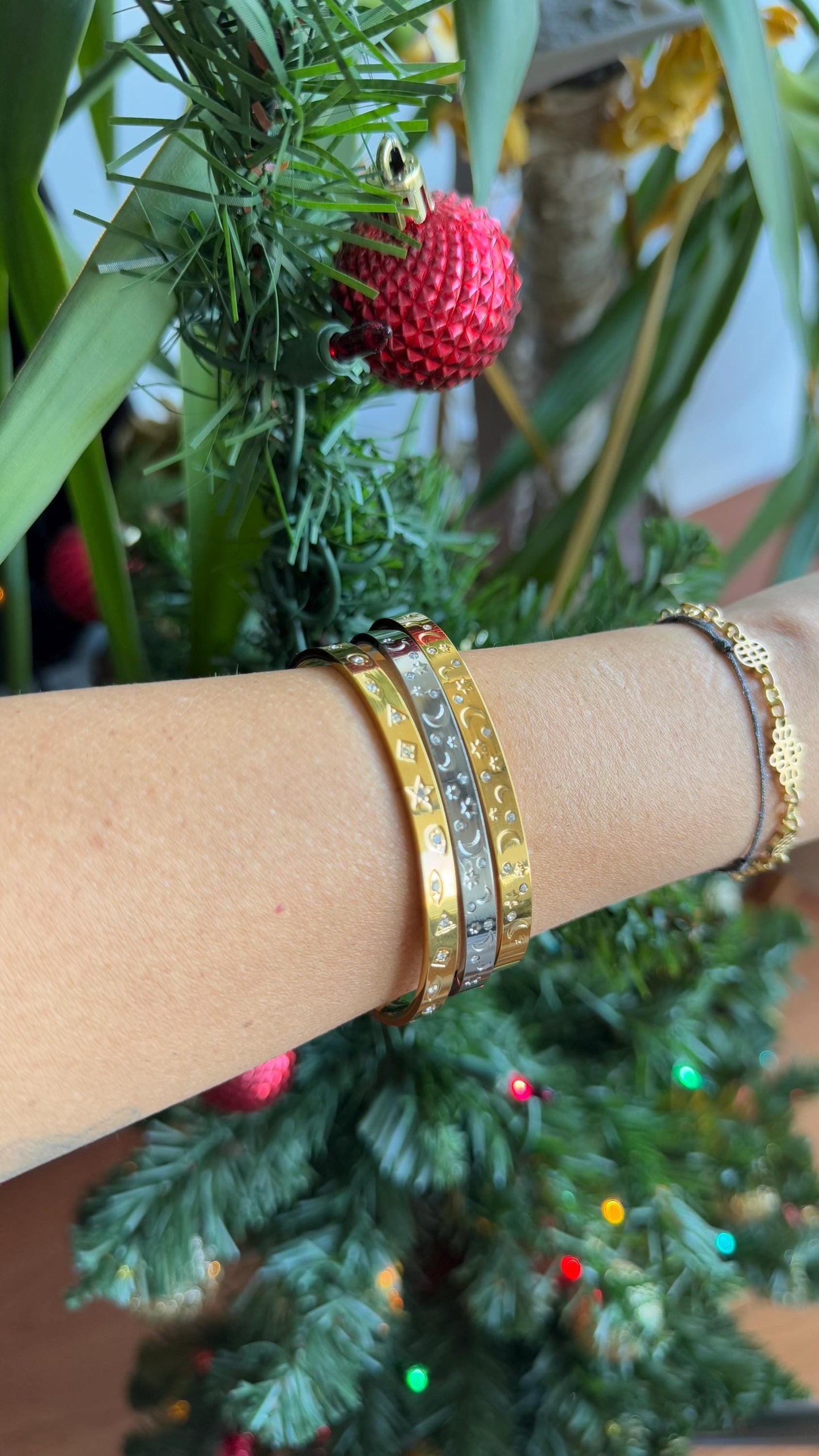 Gold and silver celestial cuff bracelet with star and moon engravings, adorned with sparkling crystals. A stylish cosmic-inspired accessory, perfect for stacking or wearing solo. Great celestial jewelry gift for women