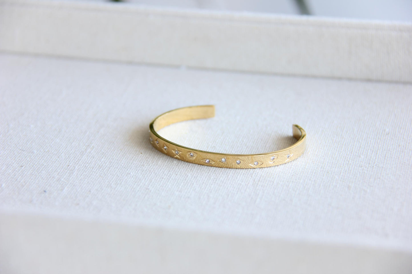 Gold and silver celestial cuff bracelet with star and moon engravings, adorned with sparkling crystals. A stylish cosmic-inspired accessory, perfect for stacking or wearing solo. Great celestial jewelry gift for women