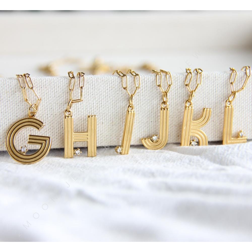 Gold initial letter necklace with a dainty pendant, perfect for personalized jewelry lovers. Elegant and minimalist custom letter necklace for everyday wear or layering. Custom letter charm necklace, a thoughtful gift for friends, bridesmaids or mom.