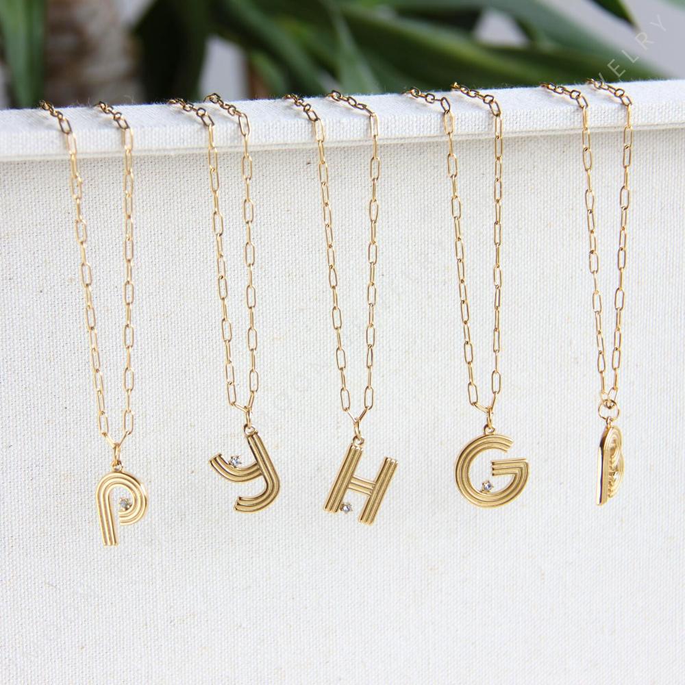Gold initial letter necklace with a dainty pendant, perfect for personalized jewelry lovers. Elegant and minimalist custom letter necklace for everyday wear or layering. Custom letter charm necklace, a thoughtful gift for friends, bridesmaids or mom.