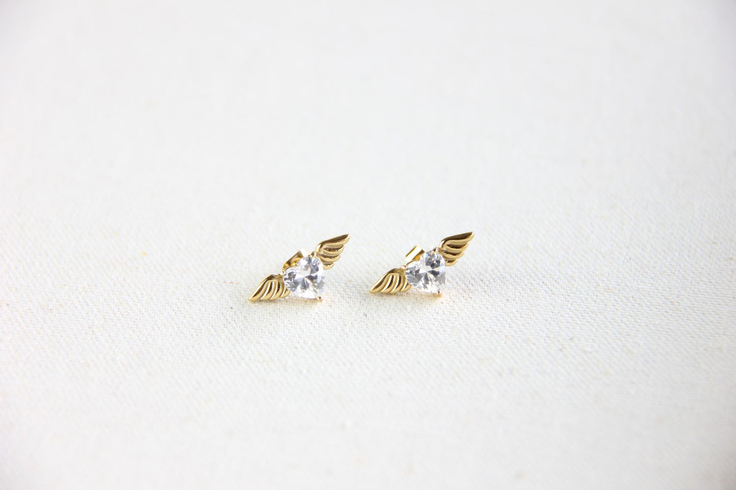 Angel wing heart stud 18K gold plated earrings , featuring a delicate and symbolic design. Dainty and lightweight earrings, perfect for everyday wear or special occasions. Guardian angel-inspired jewelry, a meaningful gift for her. Mom Gifts Ideas