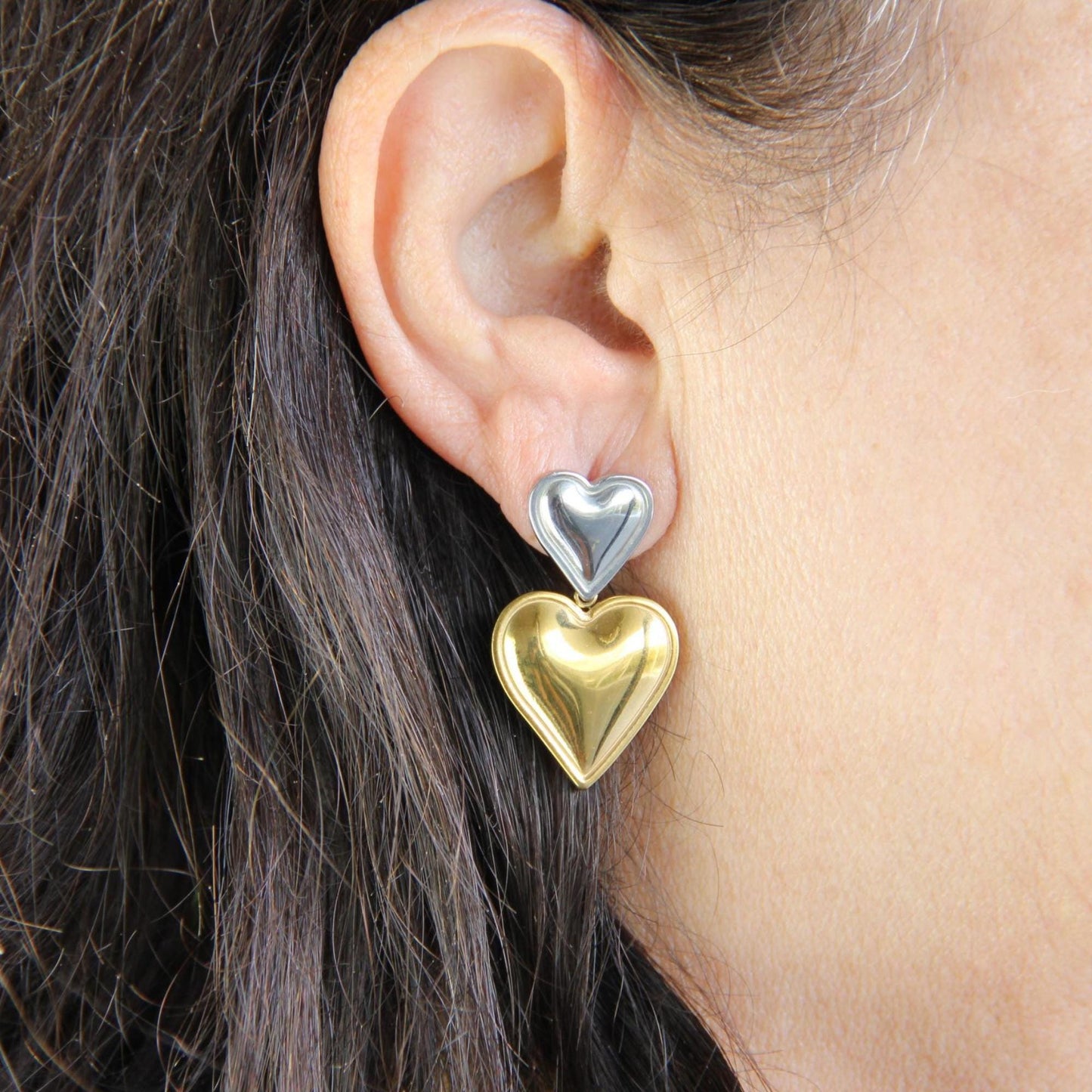 Two-color heart dangle drop earrings in gold and silver, featuring a stylish and modern design. Lightweight and elegant drop earrings, perfect for everyday wear or special occasions. Trendy perfect gift for women and girls who love unique jewelry.
