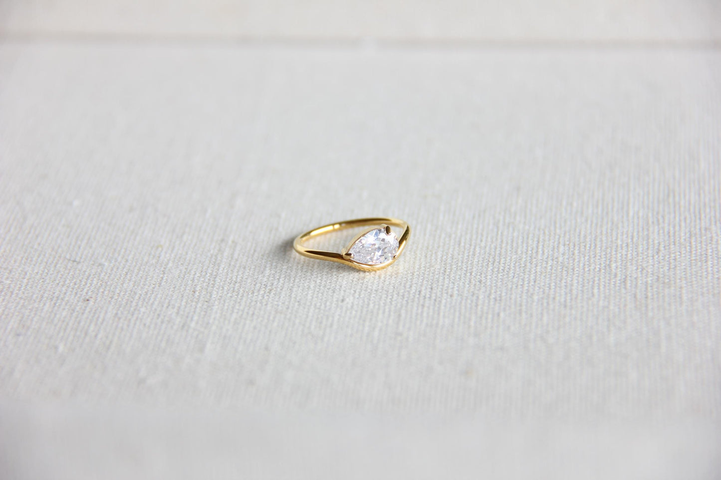 Elegant dainty zircon ring, perfect for stacking or wearing solo. Minimalist design with sparkling zircon on stainless steel band, ideal for everyday wear or gifting. Dainty waterproof gold earrings for women.
