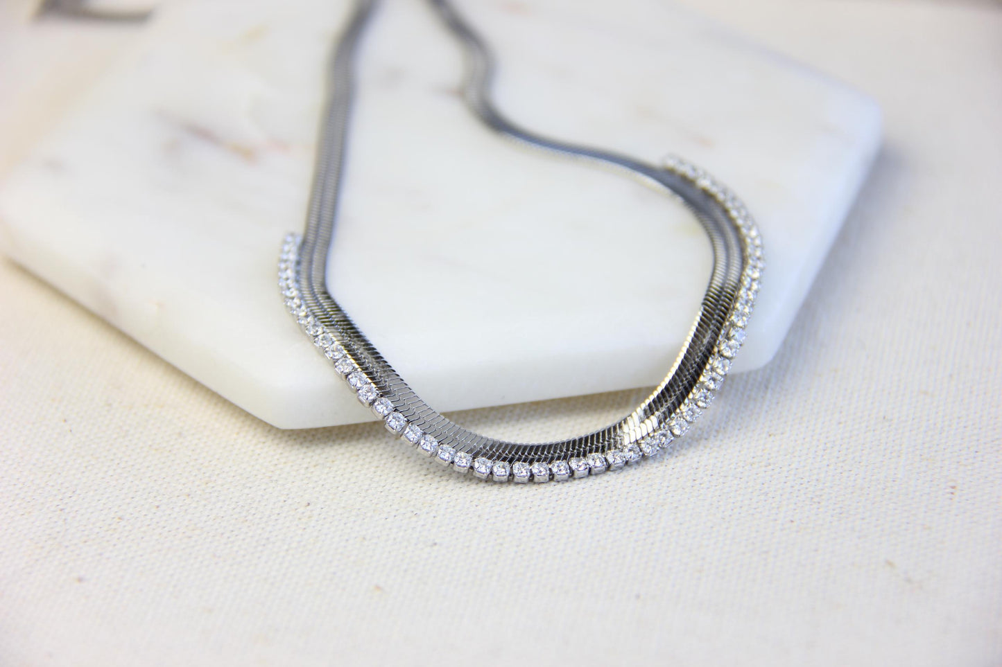 Gold snake necklace with sparkling zirconia stones, featuring a unique and minimalist design. Dainty and trendy serpent chain statement necklace, perfect for layering or wearing solo.