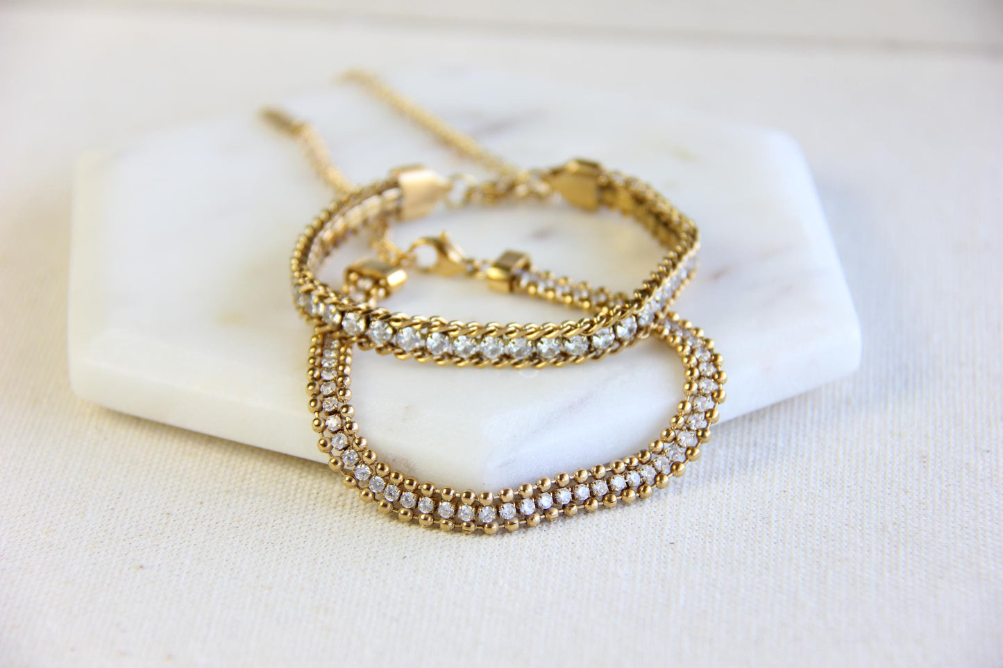 Beautiful zirconia woven gold bracelet with a touch of sparkle. Its delicate design and shimmering stones make it perfect for any outfit. Great for everyday wear, special occasions, or as a lovely gift for her.
