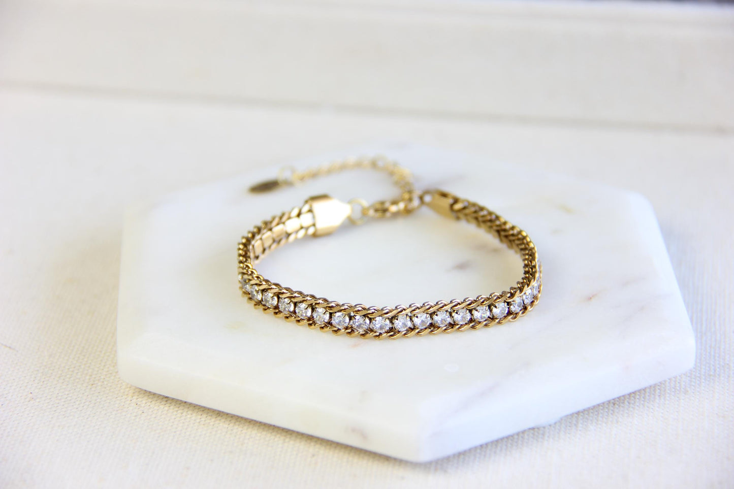 Beautiful zirconia woven gold bracelet with a touch of sparkle. Its delicate design and shimmering stones make it perfect for any outfit. Great for everyday wear, special occasions, or as a lovely gift for her.