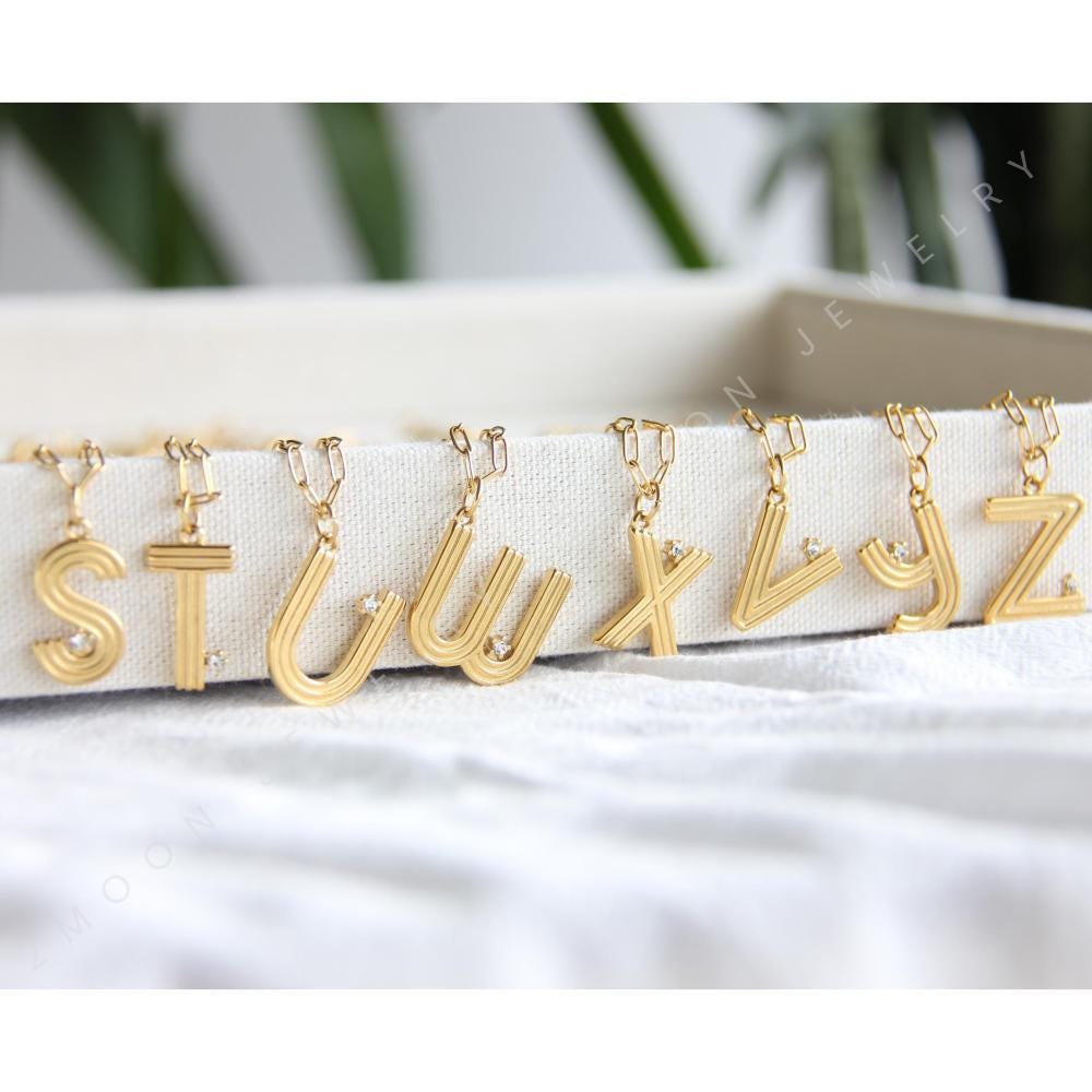 Gold initial letter necklace with a dainty pendant, perfect for personalized jewelry lovers. Elegant and minimalist custom letter necklace for everyday wear or layering. Custom letter charm necklace, a thoughtful gift for friends, bridesmaids or mom.