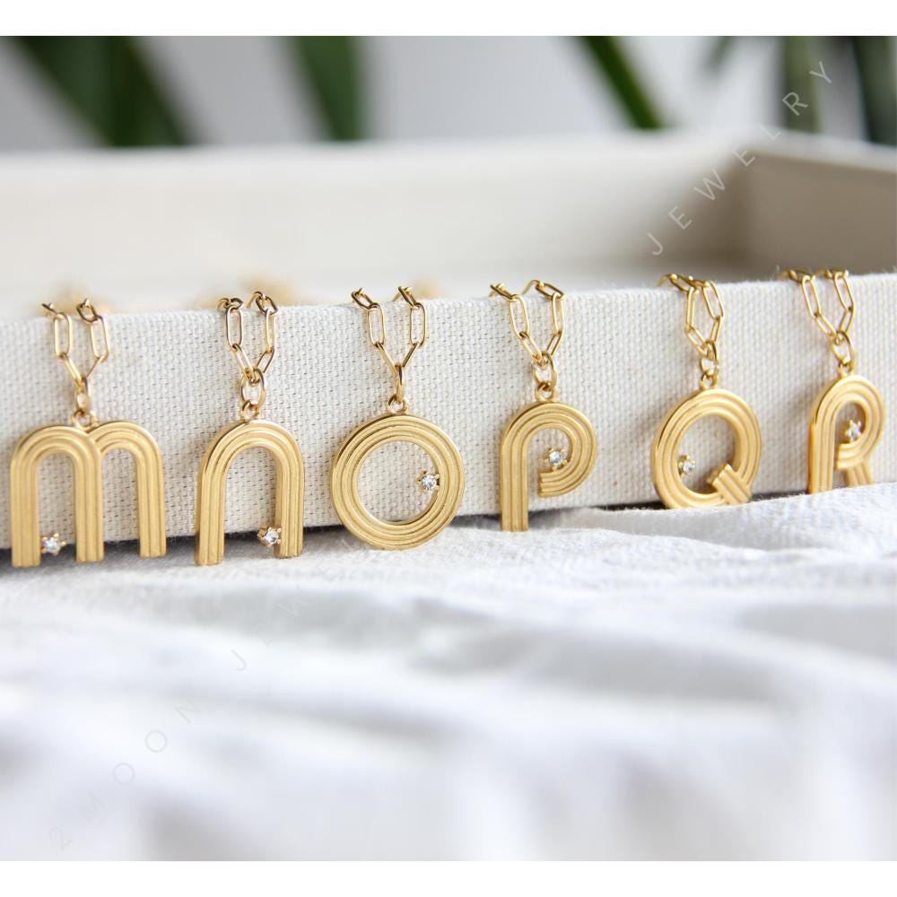 Gold initial letter necklace with a dainty pendant, perfect for personalized jewelry lovers. Elegant and minimalist custom letter necklace for everyday wear or layering. Custom letter charm necklace, a thoughtful gift for friends, bridesmaids or mom.