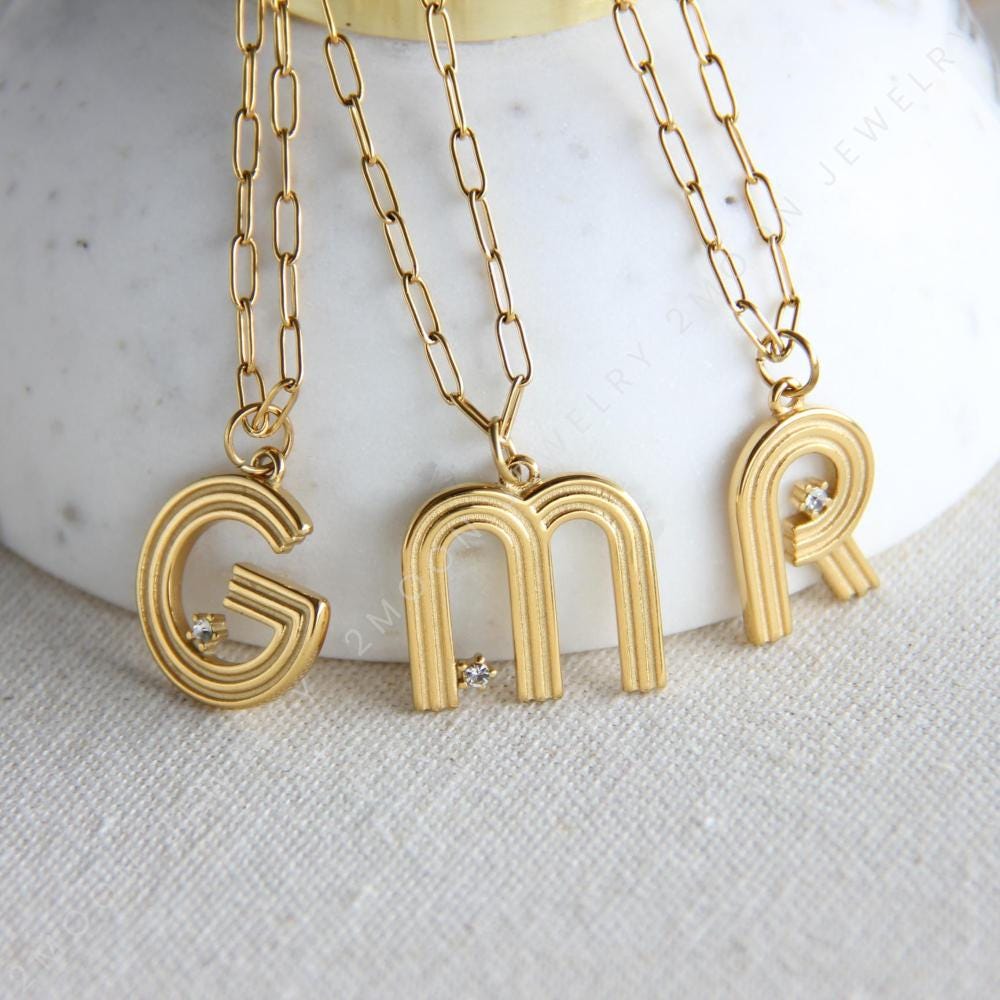 Gold initial letter necklace with a dainty pendant, perfect for personalized jewelry lovers. Elegant and minimalist custom letter necklace for everyday wear or layering. Custom letter charm necklace, a thoughtful gift for friends, bridesmaids or mom.