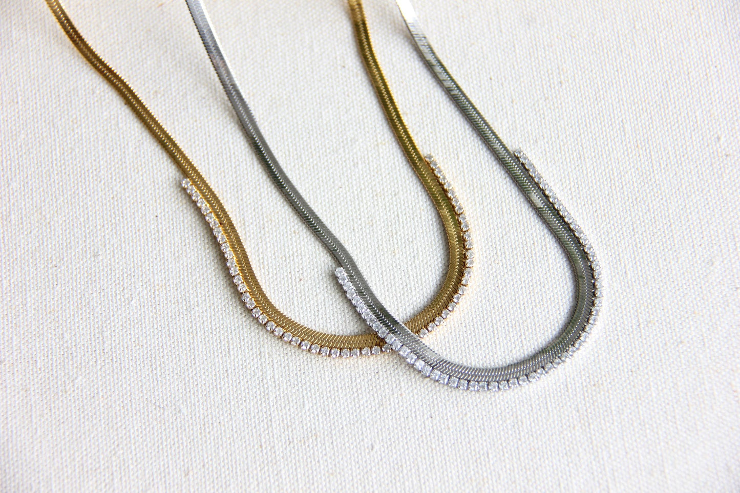Gold snake necklace with sparkling zirconia stones, featuring a unique and minimalist design. Dainty and trendy serpent chain statement necklace, perfect for layering or wearing solo.