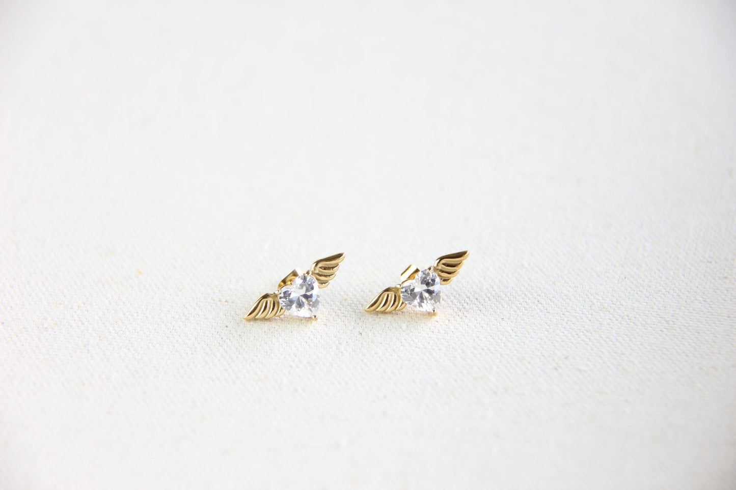 Angel wing heart stud 18K gold plated earrings , featuring a delicate and symbolic design. Dainty and lightweight earrings, perfect for everyday wear or special occasions. Guardian angel-inspired jewelry, a meaningful gift for her. Mom Gifts Ideas