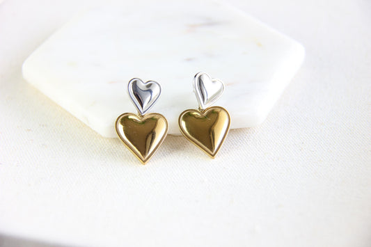 Two-color heart dangle drop earrings in gold and silver, featuring a stylish and modern design. Lightweight and elegant drop earrings, perfect for everyday wear or special occasions. Trendy perfect gift for women and girls who love unique jewelry.