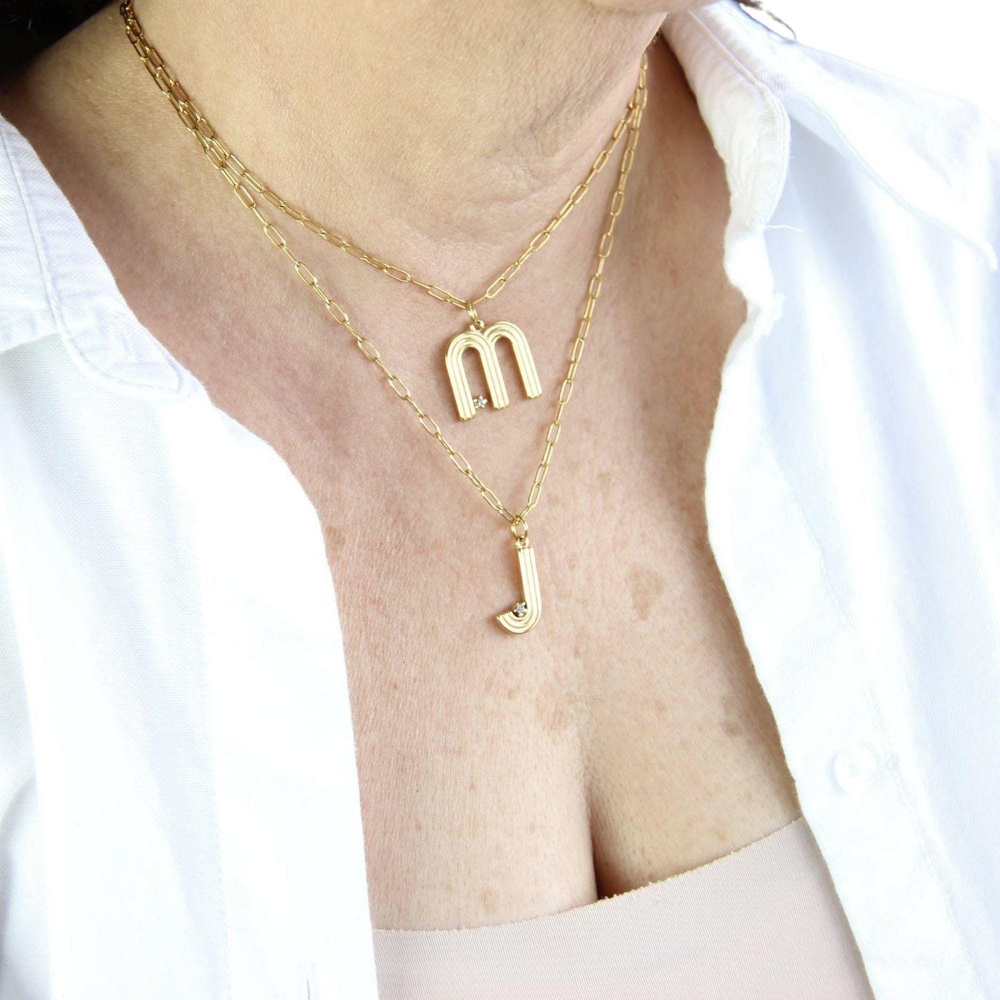 Gold initial letter necklace with a dainty pendant, perfect for personalized jewelry lovers. Elegant and minimalist custom letter necklace for everyday wear or layering. Custom letter charm necklace, a thoughtful gift for friends, bridesmaids or mom.