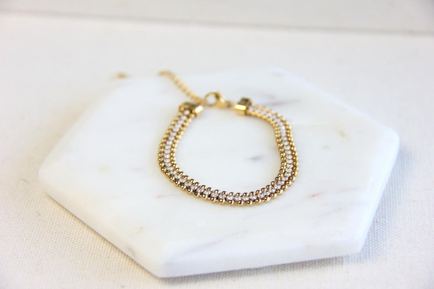 Beautiful zirconia woven gold bracelet with a touch of sparkle. Its delicate design and shimmering stones make it perfect for any outfit. Great for everyday wear, special occasions, or as a lovely gift for her.
