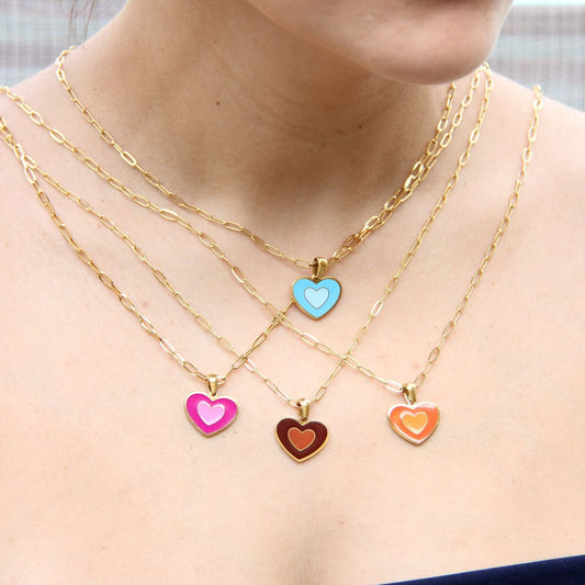 Brighten up your outfit with our Colorful Heart Pendant Chain Necklaces! Whether you&#39;re dressing up for a special event or adding a pop of color to your everyday look, this necklace offers dainty and colorful style. Perfect gift for her.