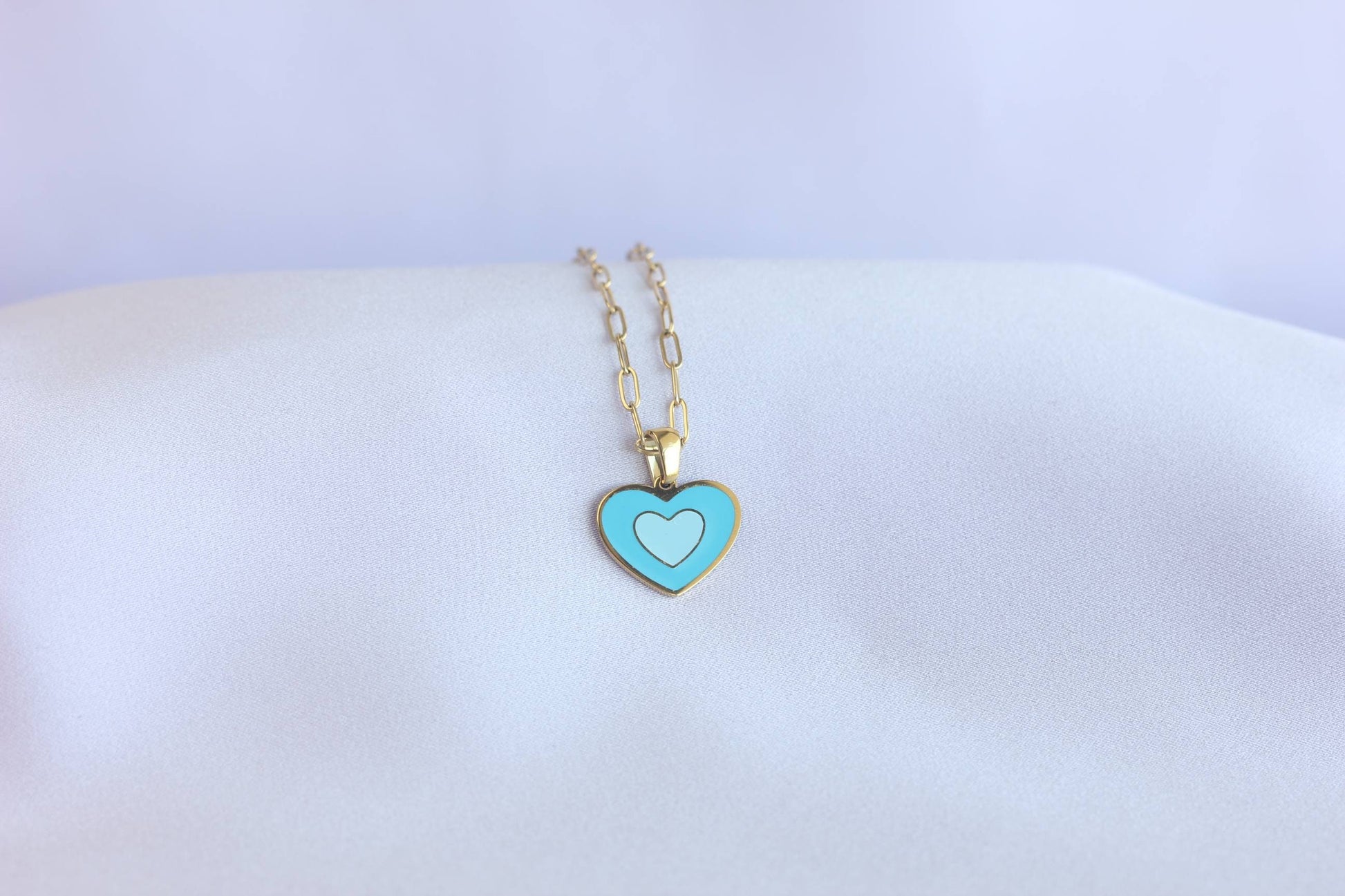 Brighten up your outfit with our Colorful Heart Pendant Chain Necklaces! Whether you&#39;re dressing up for a special event or adding a pop of color to your everyday look, this necklace offers dainty and colorful style. Perfect gift for her.