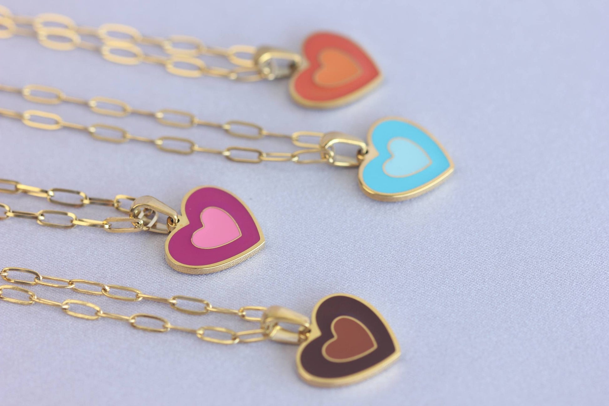 Brighten up your outfit with our Colorful Heart Pendant Chain Necklaces! Whether you&#39;re dressing up for a special event or adding a pop of color to your everyday look, this necklace offers dainty and colorful style. Perfect gift for her.