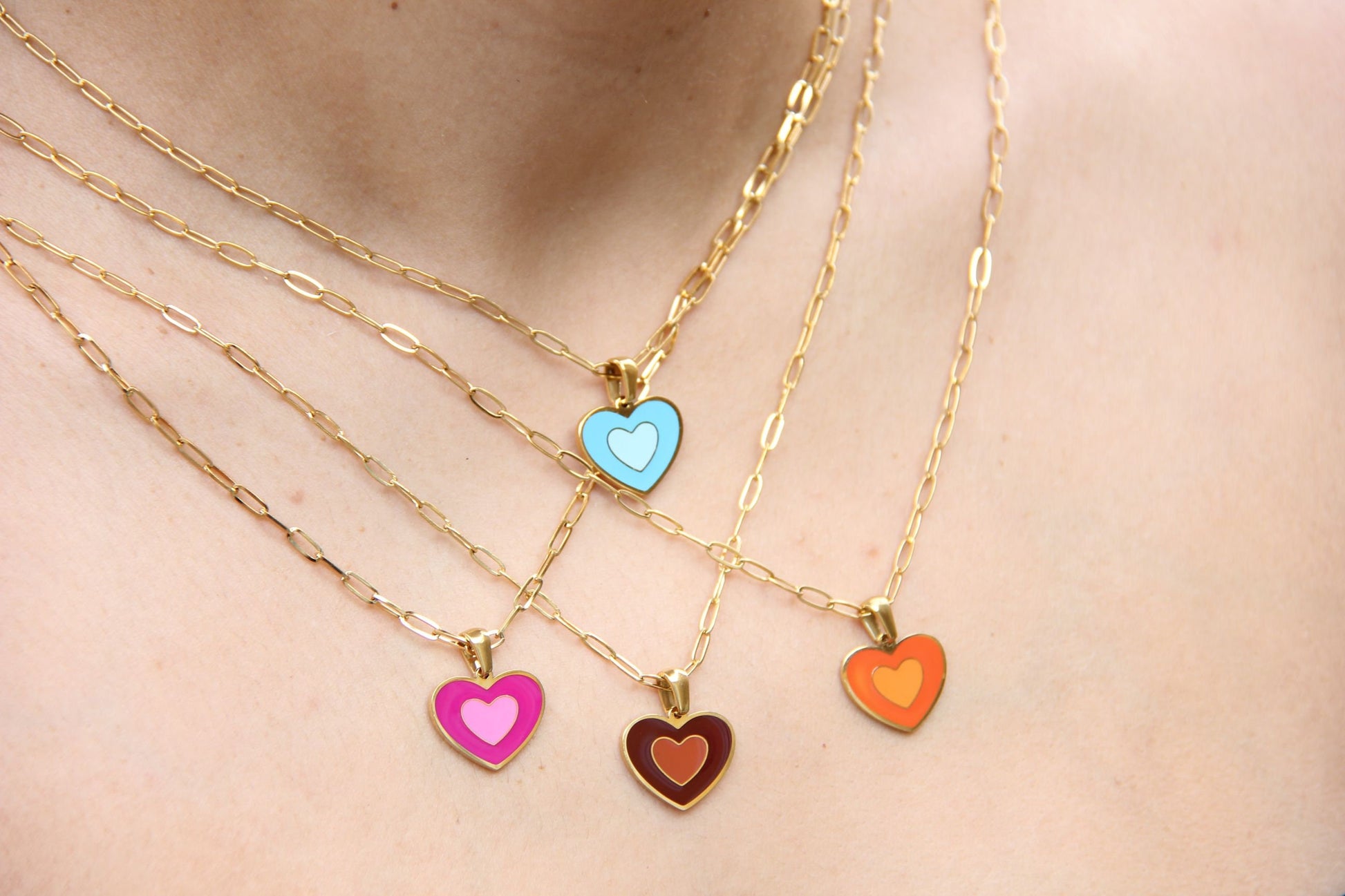 Brighten up your outfit with our Colorful Heart Pendant Chain Necklaces! Whether you&#39;re dressing up for a special event or adding a pop of color to your everyday look, this necklace offers dainty and colorful style. Perfect gift for her.