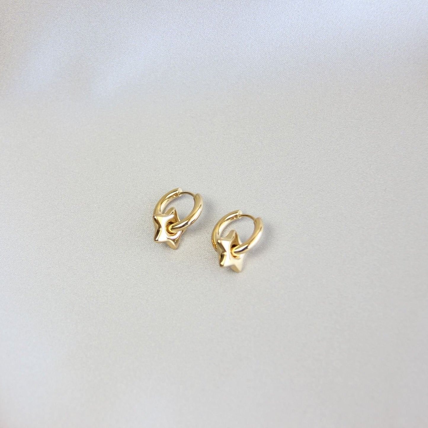 Star, Moon and Heart Pendant Gold Huggie Earrings. Mix and Match 18K gold hoop celestial earrings. Perfect gift for your loved ones.