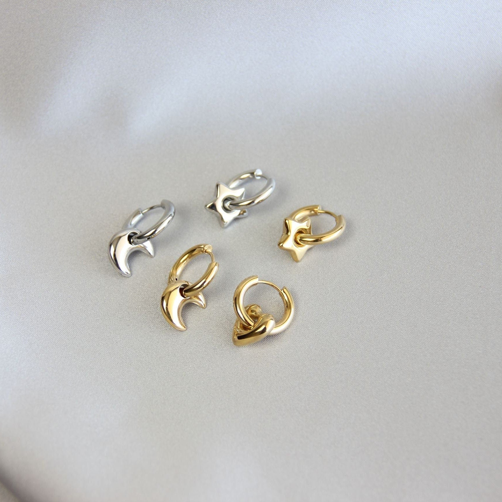 Star, Moon and Heart Pendant Gold Huggie Earrings. Mix and Match 18K gold hoop celestial earrings. Perfect gift for your loved ones.