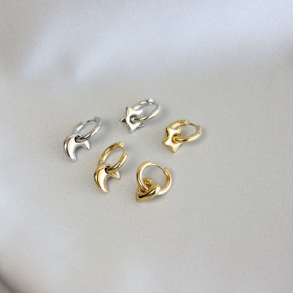 Star, Moon and Heart Pendant Gold Huggie Earrings. Mix and Match 18K gold hoop celestial earrings. Perfect gift for your loved ones.