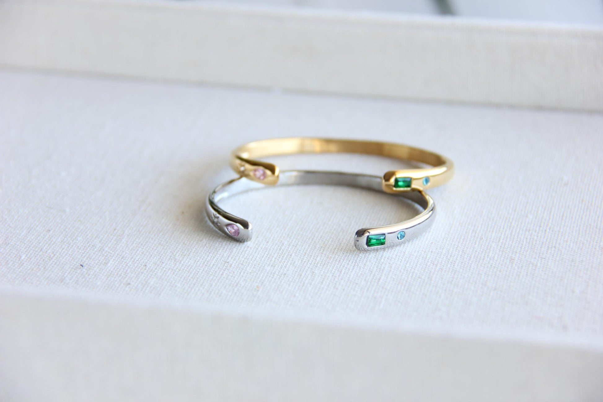 Gold and silver open cuff bracelet with pink gemstone and starburst engraving. Elegant celestial-inspired jewelry, perfect for stacking or wearing alone. Minimalist astrology bracelet, great gift for women who love dainty and cosmic jewelry.