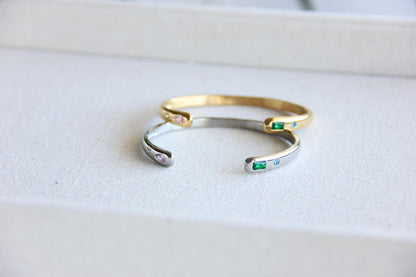 Gold and silver open cuff bracelet with pink gemstone and starburst engraving. Elegant celestial-inspired jewelry, perfect for stacking or wearing alone. Minimalist astrology bracelet, great gift for women who love dainty and cosmic jewelry.