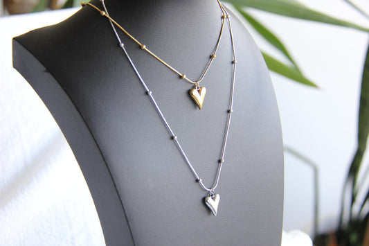 Add timeless elegance to your look with our dainty Beaded Chain Heart Pendant Charm Necklace. A perfect everyday accessory that radiates love and style!