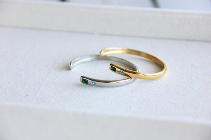 Gold and silver open cuff bracelet with pink gemstone and starburst engraving. Elegant celestial-inspired jewelry, perfect for stacking or wearing alone. Minimalist astrology bracelet, great gift for women who love dainty and cosmic jewelry.