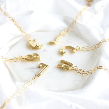 Gold initial letter necklace with a dainty pendant, perfect for personalized jewelry lovers. Elegant and minimalist custom letter necklace for everyday wear or layering. Custom letter charm necklace, a thoughtful gift for friends, bridesmaids or mom.
