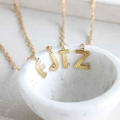 Gold initial letter necklace with a dainty pendant, perfect for personalized jewelry lovers. Elegant and minimalist custom letter necklace for everyday wear or layering. Custom letter charm necklace, a thoughtful gift for friends, bridesmaids or mom.