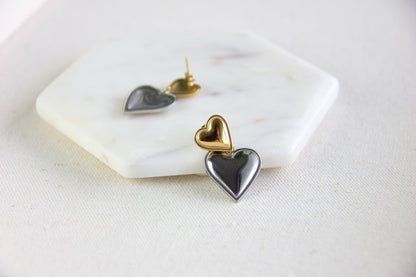 Two-color heart dangle drop earrings in gold and silver, featuring a stylish and modern design. Lightweight and elegant drop earrings, perfect for everyday wear or special occasions. Trendy perfect gift for women and girls who love unique jewelry.