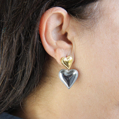 Two-color heart dangle drop earrings in gold and silver, featuring a stylish and modern design. Lightweight and elegant drop earrings, perfect for everyday wear or special occasions. Trendy perfect gift for women and girls who love unique jewelry.
